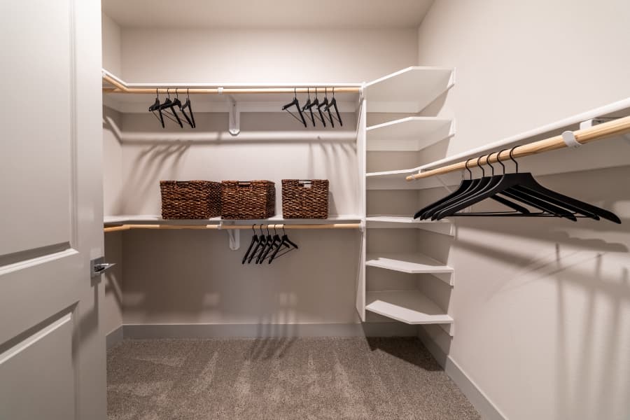 Sizeable closet in an apartment with storage areas and hangers